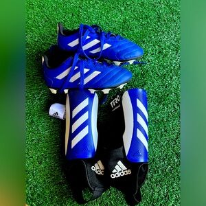 Adidas Size 10k soccer cleats and size small shin guards